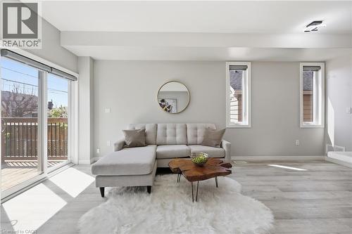 Open-concept living area featuring light wood-finish flooring, light gray walls, and recessed lighting - 37 Delena Avenue S, Hamilton, ON - Indoor Photo Showing Living Room