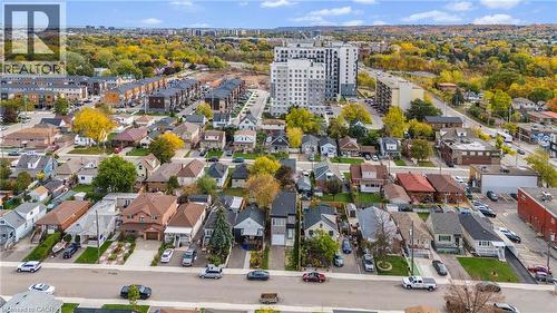 Aerial perspective showcasing a residential street with detached homes, an apartment building, and townhouses - 37 Delena Avenue S, Hamilton, ON - Outdoor With View