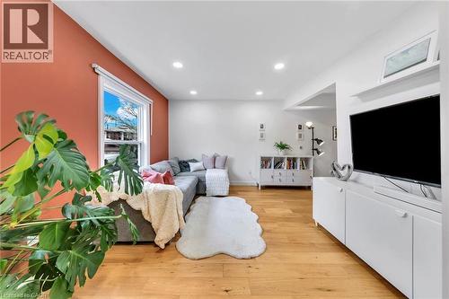 Bright living area featuring wood-finish flooring and recessed lighting - 501 Ferguson Avenue N, Hamilton, ON - Indoor Photo Showing Living Room