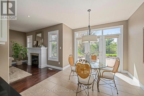 28 - 2615 Colonel Talbot Road, London South (South K), ON - Indoor Photo Showing Dining Room With Fireplace