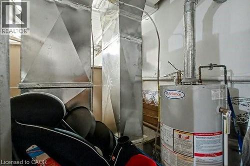Reliance water heater with visible gas line and vent piping - 37 Wellington Street, Cambridge, ON 