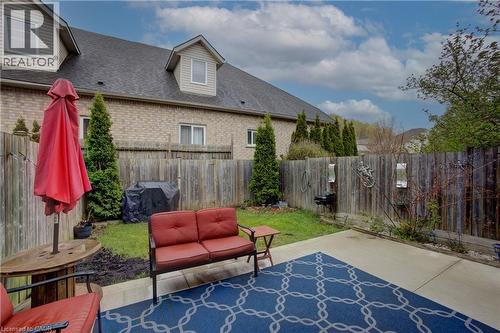 Private backyard with a concrete patio - 53 Prosperity Drive, Kitchener, ON - Outdoor
