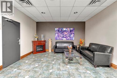 540 Ouellette Unit# 7B, Windsor, ON - Indoor Photo Showing Living Room With Fireplace