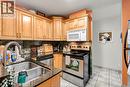 540 Ouellette Unit# 7B, Windsor, ON  - Indoor Photo Showing Kitchen With Double Sink 
