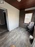Room featuring wood-finish flooring, a wood-paneled ceiling, and a brick accent wall with a window - 61 Waterloo Drive, Kitchener, ON  -  Photo Showing Other Room 