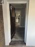 Dark wood entry door with glass paneling, brick exterior, and light-colored trim - 61 Waterloo Drive, Kitchener, ON  -  Photo Showing Other Room 