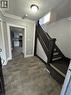 Entryway featuring wood-finish flooring, a dark wood staircase with white risers, and white trim - 61 Waterloo Drive, Kitchener, ON  - Indoor Photo Showing Other Room 