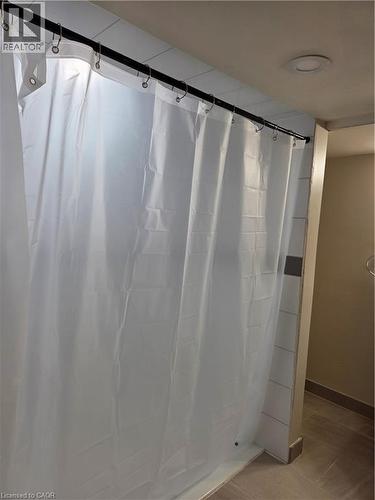 Shower stall with white subway tile surround, tile flooring, and recessed ceiling lighting - 125 Cavell Avenue, Hamilton, ON - Indoor Photo Showing Bathroom