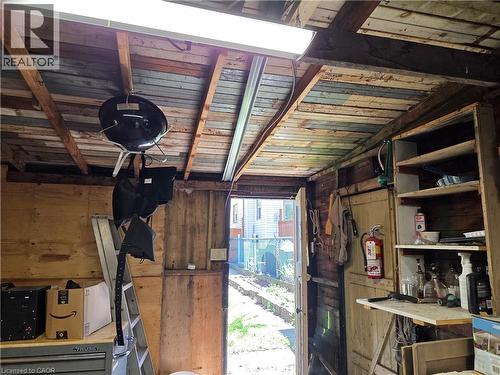 Utility shed with exposed wood framing, built-in shelving, and plywood wall finishes - 125 Cavell Avenue, Hamilton, ON - Indoor