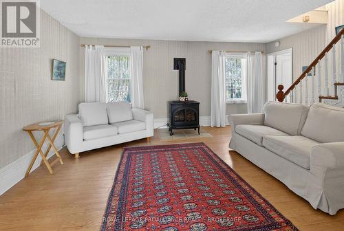 1 Pond Street, Westport, ON - Indoor Photo Showing Living Room With Fireplace