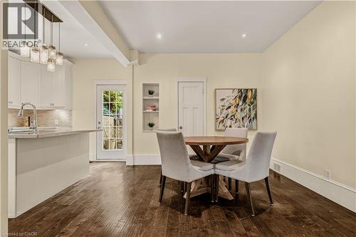 Open-concept dining space with wood-finish flooring, recessed lighting, and built-in wall niches - 104 Barnesdale Avenue N, Hamilton, ON - Indoor Photo Showing Dining Room