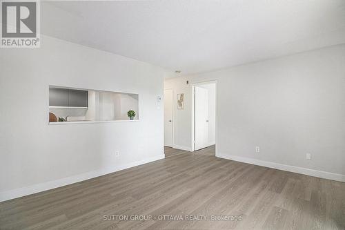 Living/dining room with opening to kitchen - 314 - 270 Brittany Drive, Ottawa, ON - Indoor Photo Showing Other Room