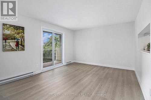 Living/Dining room with patio door to balcony - 314 - 270 Brittany Drive, Ottawa, ON - Indoor Photo Showing Other Room