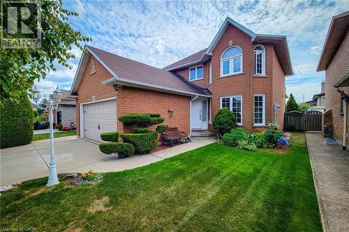 Brick exterior featuring a gabled roof and white trim - 146 Locheed Drive, Hamilton, ON - Outdoor