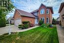 Brick exterior featuring a gabled roof and white trim - 146 Locheed Drive, Hamilton, ON  - Outdoor 