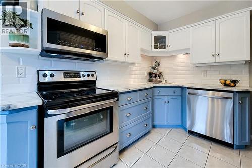 Modern kitchen featuring two-tone cabinetry, subway tile backsplash, and stainless steel appliances - 146 Locheed Drive, Hamilton, ON - Indoor Photo Showing Kitchen With Stainless Steel Kitchen