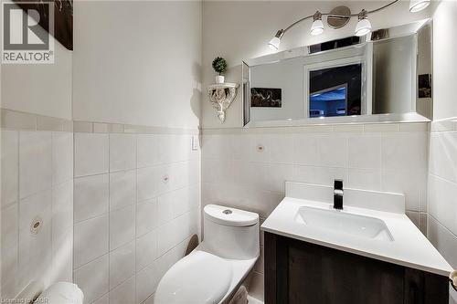 Bathroom with white square wall tiles and a light-colored trim - 146 Locheed Drive, Hamilton, ON - Indoor Photo Showing Bathroom