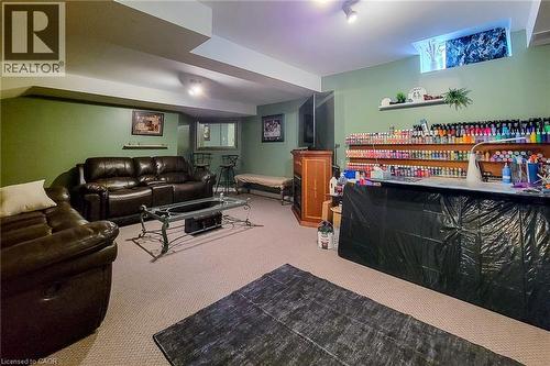 Carpeted lower level featuring recessed lighting and green painted walls - 146 Locheed Drive, Hamilton, ON - Indoor