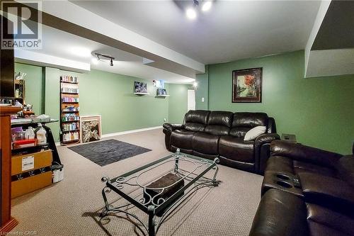 Expansive recreation room featuring light green walls, light-colored carpet flooring, and recessed ceiling lighting - 146 Locheed Drive, Hamilton, ON - Indoor