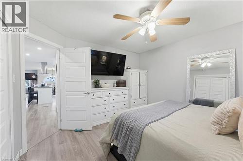 Neutral wall tones with wood-finish flooring - 29 Strong Court, Brantford, ON - Indoor Photo Showing Bedroom