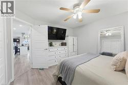 Neutral wall tones with wood-finish flooring - 