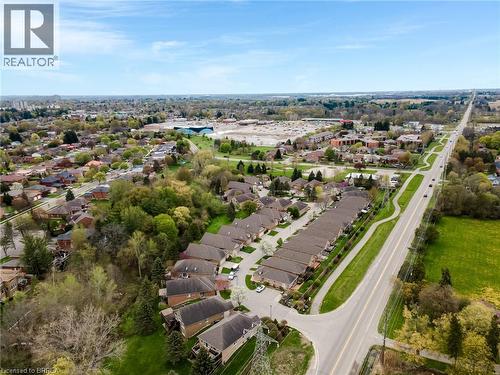 Aerial perspective showcasing a residential community with mature landscaping - 422 Powerline Road Unit# 10, Brantford, ON - Outdoor With View