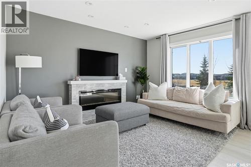 3181 Mazurak Crescent, Regina, SK - Indoor Photo Showing Living Room With Fireplace