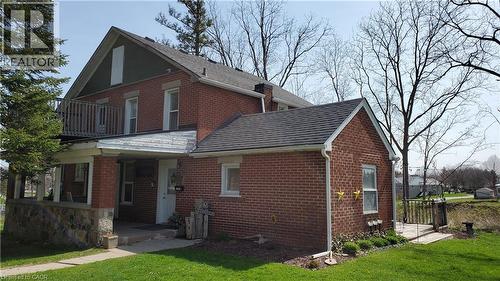 Brick exterior with a covered front porch featuring stone and brick columns - 3355 King Street E, Kitchener, ON - Outdoor