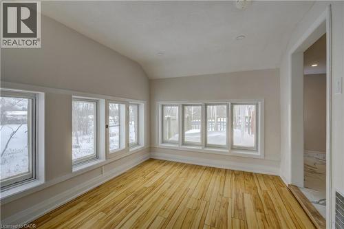 Room featuring wood-finish flooring, white baseboards, and light-colored walls - 3355 King Street E, Kitchener, ON - Indoor Photo Showing Other Room