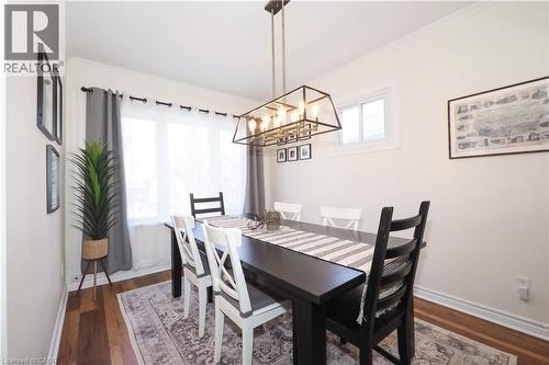 Bright, light-filled formal dining room featuring large window and new lighting. Could potential be used as a main floor office or bedroom. - 123 Samuel Street, Kitchener, ON - Indoor Photo Showing Dining Room