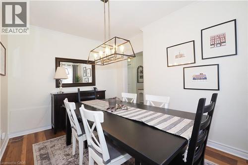 Bright, light-filled formal dining room featuring large window and new lighting. Could potential be used as a main floor office or bedroom. - 123 Samuel Street, Kitchener, ON - Indoor Photo Showing Dining Room
