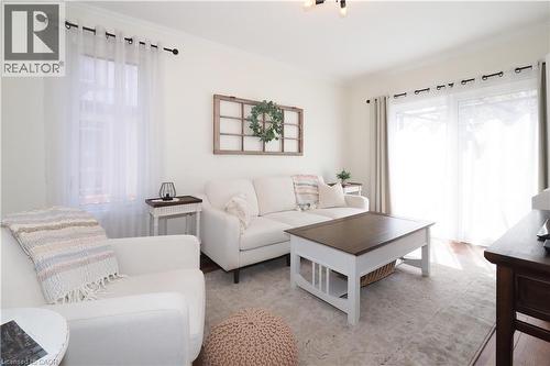 Inviting living room with new sliding glass doors leading to the deck and landscaped backyard. - 123 Samuel Street, Kitchener, ON - Indoor Photo Showing Living Room