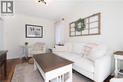 Inviting living room with new sliding glass doors leading to the deck and landscaped backyard. - 123 Samuel Street, Kitchener, ON - Indoor Photo Showing Living Room