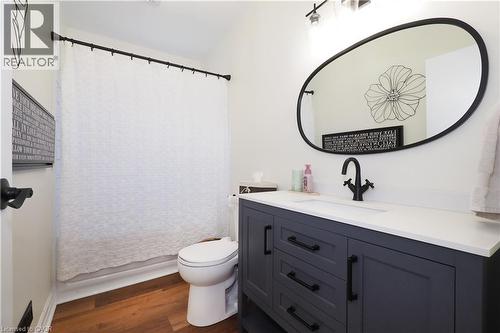Updated main floor bathroom with tub & shower combo and new toilet & vanity. - 123 Samuel Street, Kitchener, ON - Indoor Photo Showing Bathroom