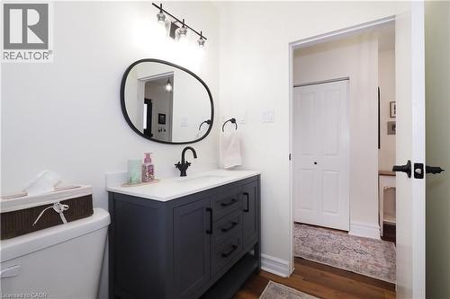 Updated main floor bathroom with tub & shower combo and new toilet & vanity. - 123 Samuel Street, Kitchener, ON - Indoor Photo Showing Bathroom