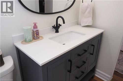 Updated main floor bathroom with tub & shower combo and new toilet & vanity. - 123 Samuel Street, Kitchener, ON - Indoor Photo Showing Bathroom