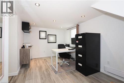 Bright recroom with full size egress window, provides lots of light. Previously used as the bedroom/recroom of a separate studio in-law suite. Two storage closets. - 123 Samuel Street, Kitchener, ON - Indoor Photo Showing Office