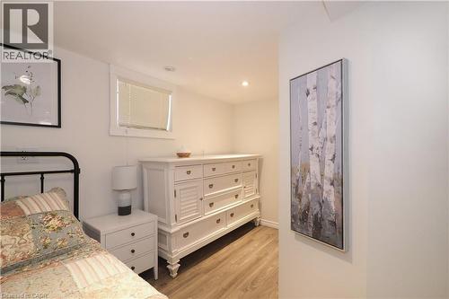 This room is plumbed for a kitchen and can be converted back as part of the potential in-law setup. - 123 Samuel Street, Kitchener, ON - Indoor Photo Showing Bedroom