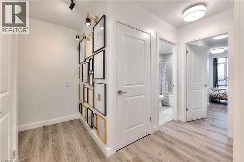 Hallway featuring light wood-style flooring and baseboards - 50 Grand Avenue S Unit# 602, Cambridge, ON - Indoor Photo Showing Other Room