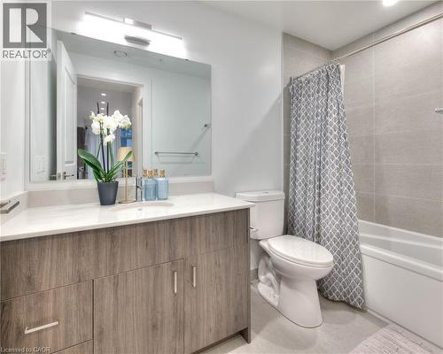 Full bath featuring vanity and shower / bath combination with curtain - 50 Grand Avenue S Unit# 602, Cambridge, ON - Indoor Photo Showing Bathroom