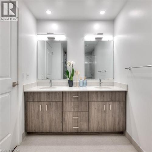 Bathroom featuring double vanity, recessed lighting, and a shower stall - 50 Grand Avenue S Unit# 602, Cambridge, ON - Indoor Photo Showing Bathroom
