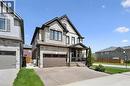 Modern two-story residence with a stone and siding exterior - 72 Elmbank Trail, Kitchener, ON  - Outdoor With Facade 