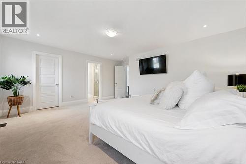 Light-colored carpeting complementing white wall finishes - 72 Elmbank Trail, Kitchener, ON - Indoor Photo Showing Bedroom