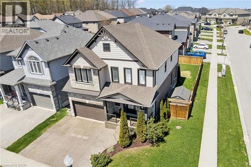 Two-story home featuring a stone and siding exterior with dark trim accents - 72 Elmbank Trail, Kitchener, ON - Outdoor