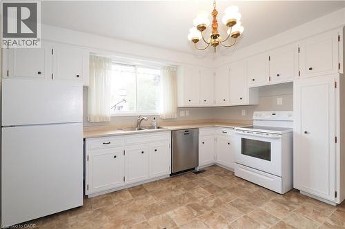 Kitchen appliances & cabinetry - 76 Cloverdale Crescent, Kitchener, ON - Indoor Photo Showing Kitchen With Double Sink