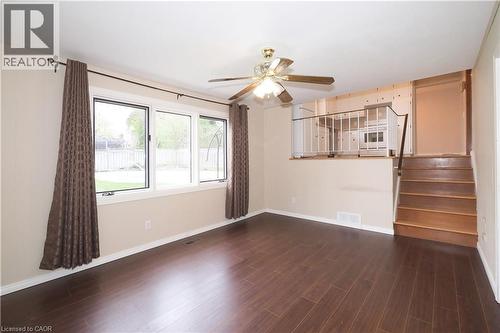 Family room with large window overlooking private back yard - 76 Cloverdale Crescent, Kitchener, ON - Indoor Photo Showing Other Room