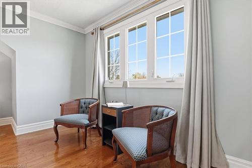 Triple-pane window with detailed muntins, framed by custom drapery - 19 Forestview Drive, Cambridge, ON - Indoor Photo Showing Other Room