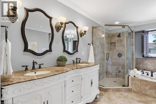 Bathroom featuring a double vanity with a decorative white cabinet and a brown stone countertop - 19 Forestview Drive, Cambridge, ON - Indoor Photo Showing Bathroom