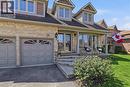 Stone and siding exterior with multiple dormer windows and an integrated two-car garage - 19 Forestview Drive, Cambridge, ON  - Outdoor 