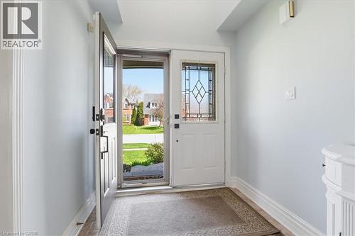 Entry foyer with light blue walls, white trim, and patterned floor covering - 19 Forestview Drive, Cambridge, ON - Indoor Photo Showing Other Room